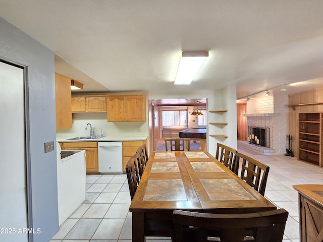 4950 Raffaele Dr, Sierra Vista, AZ 85635 - dining area with light tile patterned floors, a brick fireplace, rail lighting, and built in features