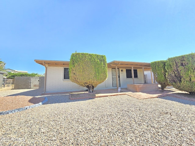 4950 Raffaele Dr, Sierra Vista, AZ 85635 - ranch-style house with brick siding and a patio area