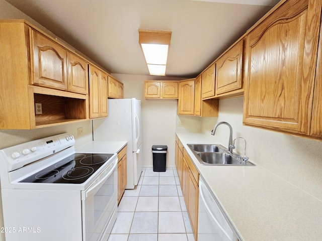 4950 Raffaele Dr, Sierra Vista, AZ 85635 - kitchen featuring white appliances, a sink, light tile patterned floors, and light countertops