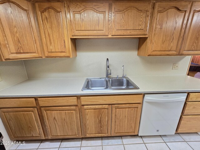 4950 Raffaele Dr, Sierra Vista, AZ 85635 - kitchen with white dishwasher, a sink, light countertops, and light tile patterned floors