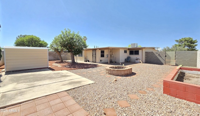 4950 Raffaele Dr, Sierra Vista, AZ 85635 - back of property featuring an outdoor fire pit, a patio, a fenced backyard, and central air condition unit