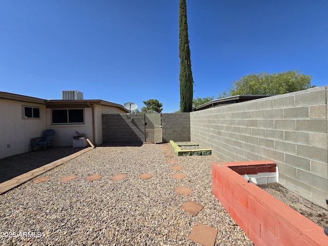 4950 Raffaele Dr, Sierra Vista, AZ 85635 - fenced backyard featuring central AC unit and a patio area