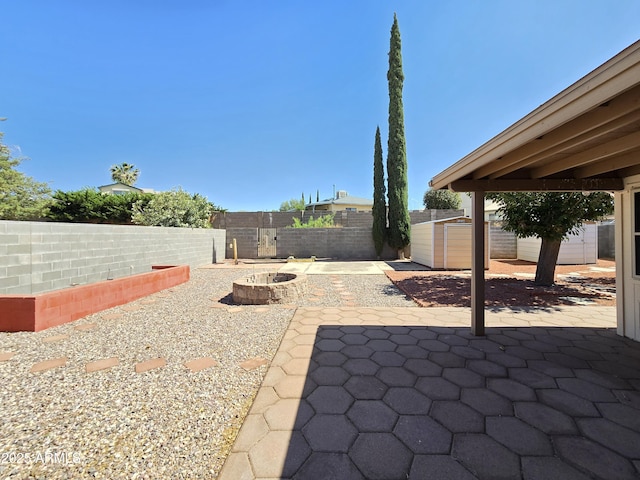 4950 Raffaele Dr, Sierra Vista, AZ 85635 - fenced backyard with an outdoor fire pit and a patio area