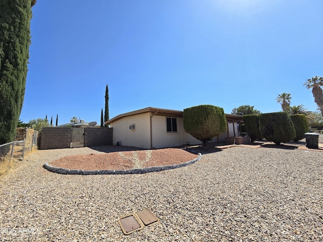 4950 Raffaele Dr, Sierra Vista, AZ 85635 - view of side of home featuring a gate and brick siding