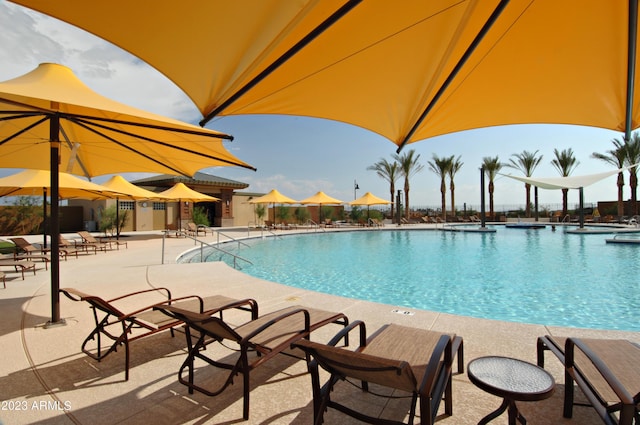 community pool with a patio area