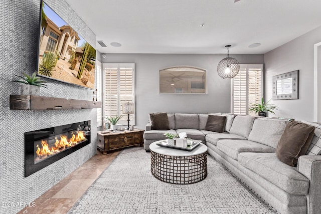 6026 E Sonoran Trl, Scottsdale, AZ 85266 - living area featuring a tiled fireplace
