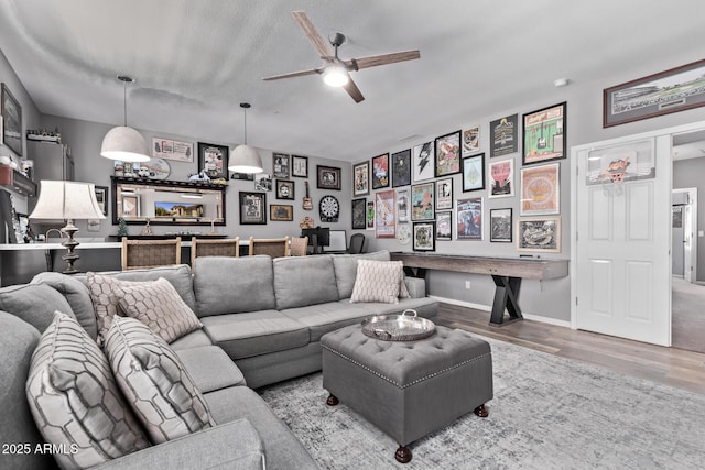 6026 E Sonoran Trl, Scottsdale, AZ 85266 - living room with wood finished floors, a ceiling fan, and baseboards