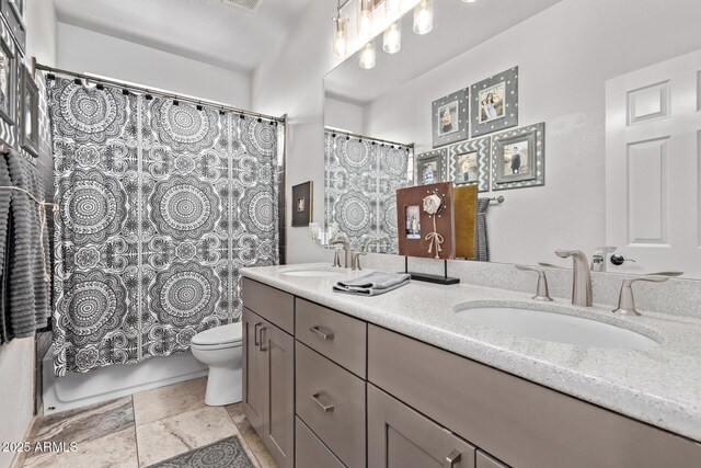 6026 E Sonoran Trl, Scottsdale, AZ 85266 - full bathroom featuring toilet, double vanity, and shower / tub combo