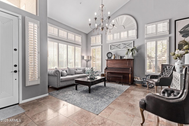 6026 E Sonoran Trl, Scottsdale, AZ 85266 - living area featuring high vaulted ceiling, a chandelier, and baseboards