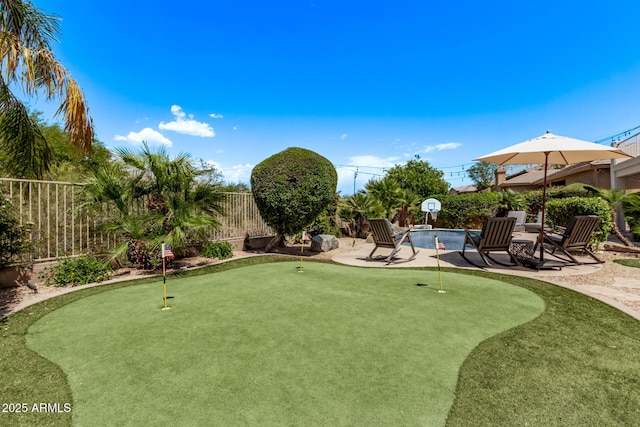 6026 E Sonoran Trl, Scottsdale, AZ 85266 - surrounding community with a putting green, a fenced backyard, and a patio