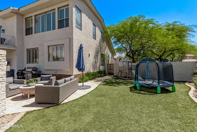 6026 E Sonoran Trl, Scottsdale, AZ 85266 - view of yard featuring a trampoline, a patio, and outdoor lounge area