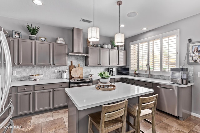 6026 E Sonoran Trl, Scottsdale, AZ 85266 - kitchen with wall chimney range hood, appliances with stainless steel finishes, gray cabinets, light countertops, and backsplash