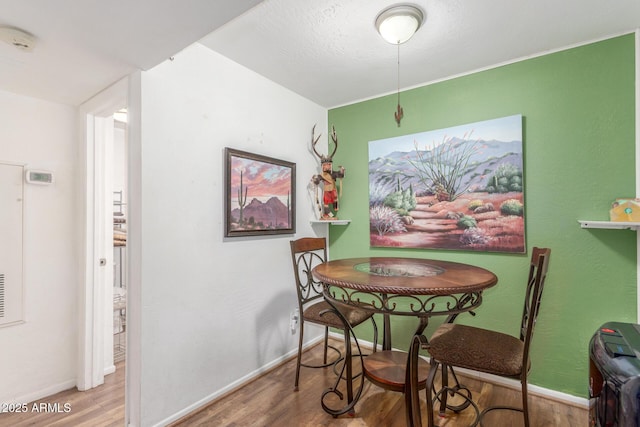 16602 N 25th St Unit 204, Phoenix, AZ 85032 - dining room with wood finished floors and baseboards