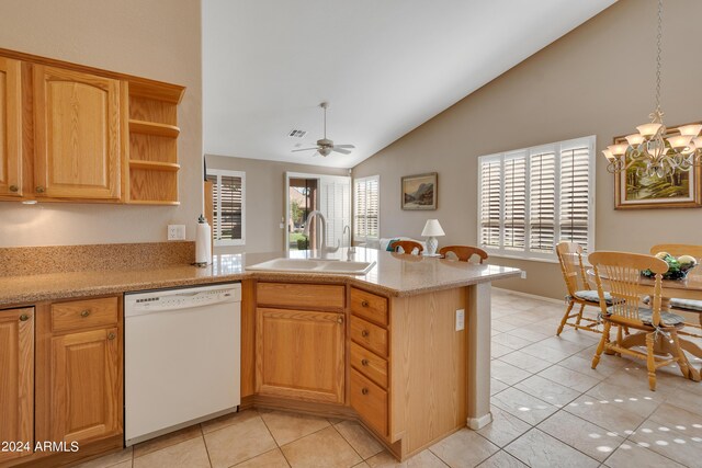 kitchen featuring dishwasher, light tile patterned flooring, sink, ceiling fan with notable chandelier, and vaulted ceiling