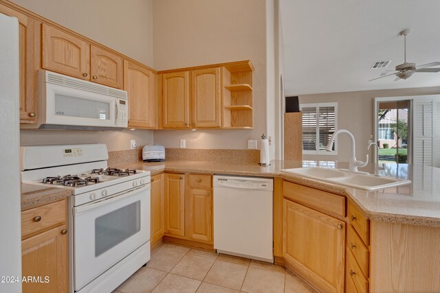 kitchen featuring light tile patterned flooring, sink, white appliances, light brown cabinets, and ceiling fan