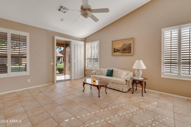 living room with light tile patterned flooring, vaulted ceiling, and ceiling fan