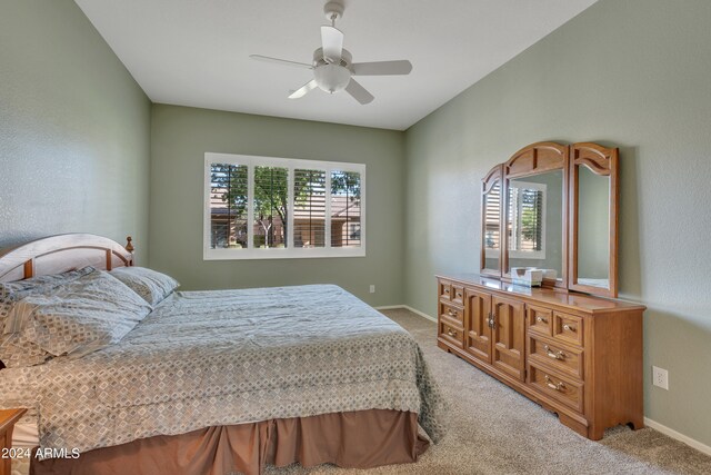 bedroom with ceiling fan and carpet floors