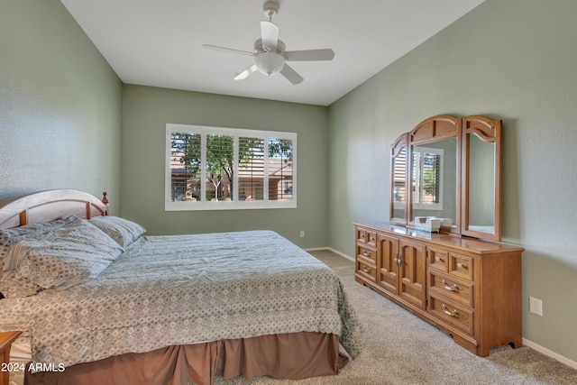 bedroom with carpet flooring, baseboards, and ceiling fan