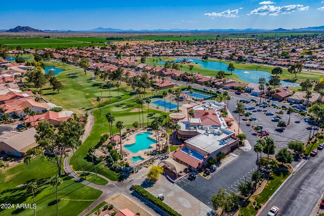 drone / aerial view with a water and mountain view