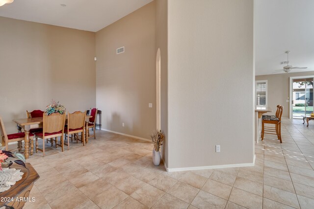 tiled dining room with ceiling fan