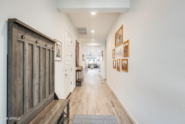 hall with light wood-type flooring