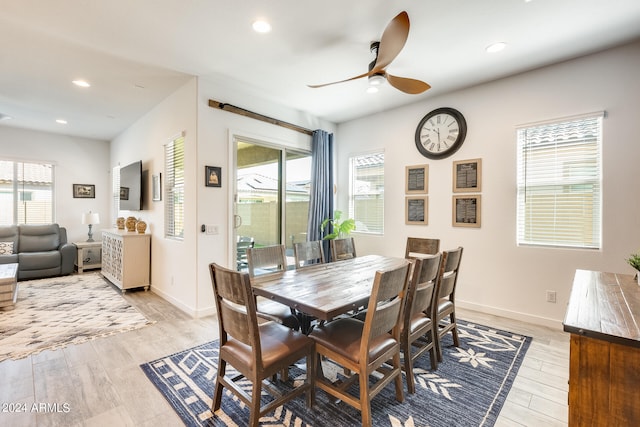 dining room with ceiling fan, light hardwood / wood-style floors, and a healthy amount of sunlight