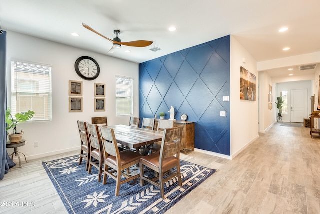 dining room featuring ceiling fan, light hardwood / wood-style flooring, and plenty of natural light