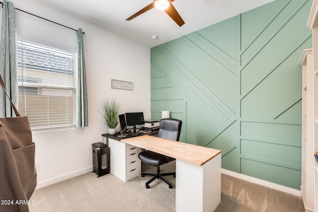 carpeted office space with ceiling fan