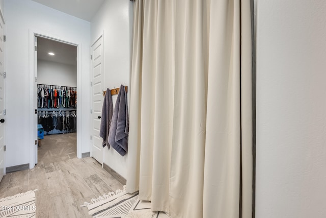 bathroom with wood-type flooring