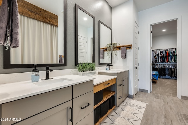 bathroom featuring vanity and hardwood / wood-style floors