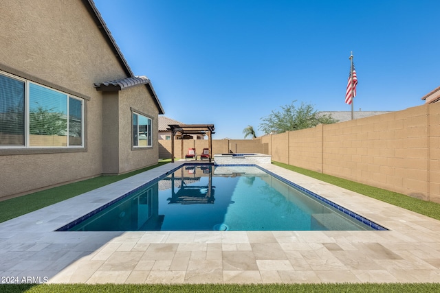 view of pool with a patio and an in ground hot tub