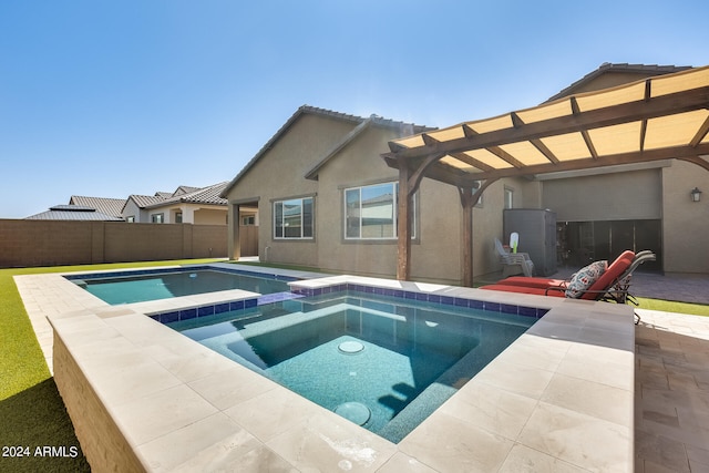 view of pool with an in ground hot tub and a patio area