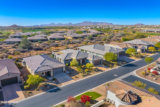 birds eye view of property with a mountain view