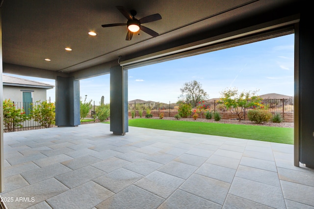 view of patio / terrace with a mountain view and ceiling fan