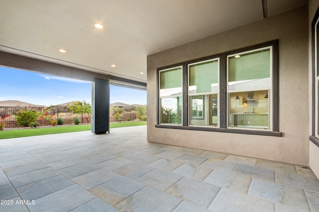 view of patio / terrace featuring a mountain view