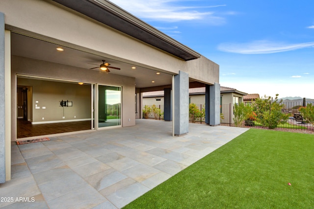 view of patio / terrace featuring ceiling fan