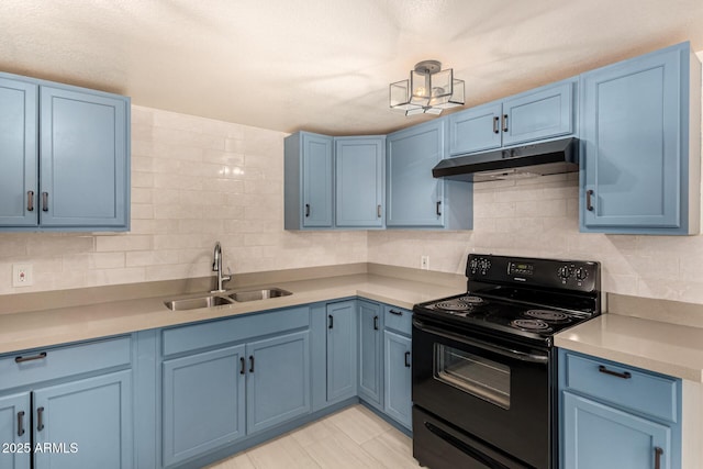 2721 W Luke Ave, Phoenix, AZ 85017 - kitchen featuring black range with electric cooktop, under cabinet range hood, a sink, blue cabinetry, and backsplash