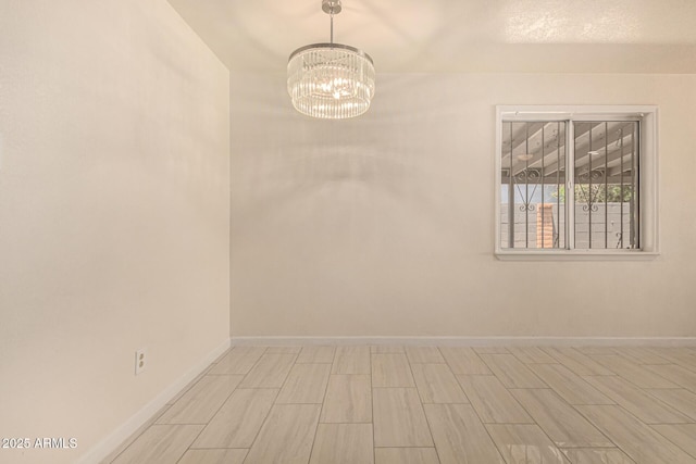 2721 W Luke Ave, Phoenix, AZ 85017 - spare room with a chandelier and baseboards