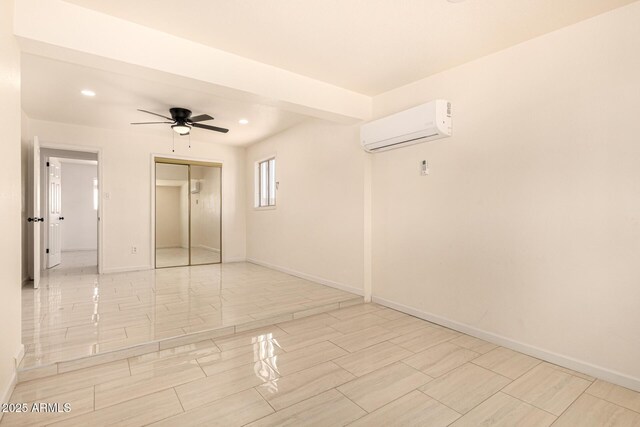2721 W Luke Ave, Phoenix, AZ 85017 - spare room featuring a wall mounted AC, ceiling fan, recessed lighting, baseboards, and wood finish floors