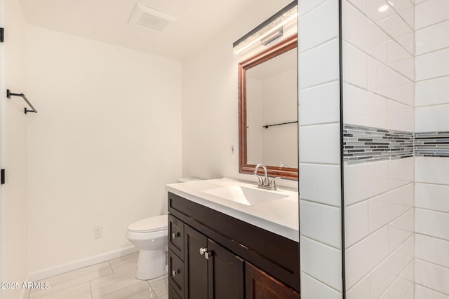 2721 W Luke Ave, Phoenix, AZ 85017 - bathroom with vanity, toilet, and baseboards