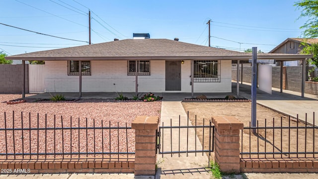 2721 W Luke Ave, Phoenix, AZ 85017 - view of front of home featuring roof with shingles, a fenced front yard, driveway, brick siding, and covered porch
