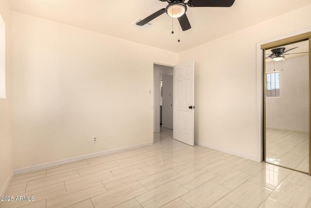 2721 W Luke Ave, Phoenix, AZ 85017 - unfurnished bedroom featuring a ceiling fan, baseboards, and a closet