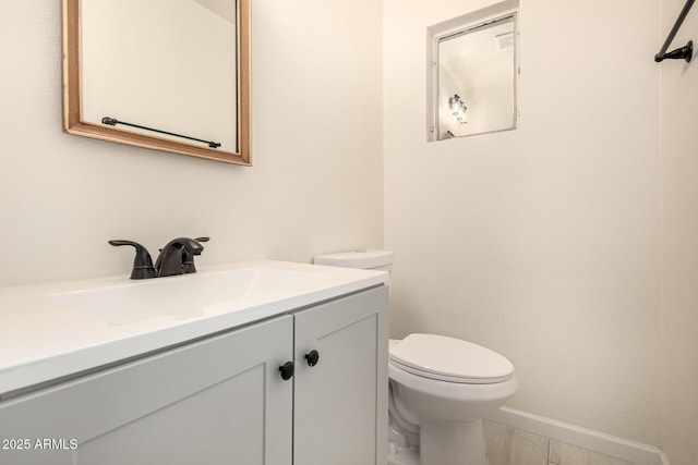 2721 W Luke Ave, Phoenix, AZ 85017 - half bathroom featuring toilet, vanity, and baseboards