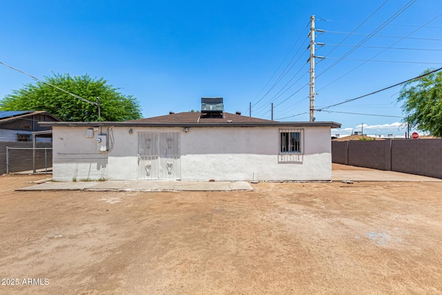 2721 W Luke Ave, Phoenix, AZ 85017 - back of house featuring stucco siding and central AC