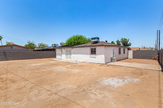 2721 W Luke Ave, Phoenix, AZ 85017 - back of property with a fenced backyard, a patio area, and stucco siding