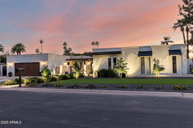 675 Val Verde Cir W, Litchfield Park, AZ 85340 - view of front of house featuring stucco siding, a garage, and driveway