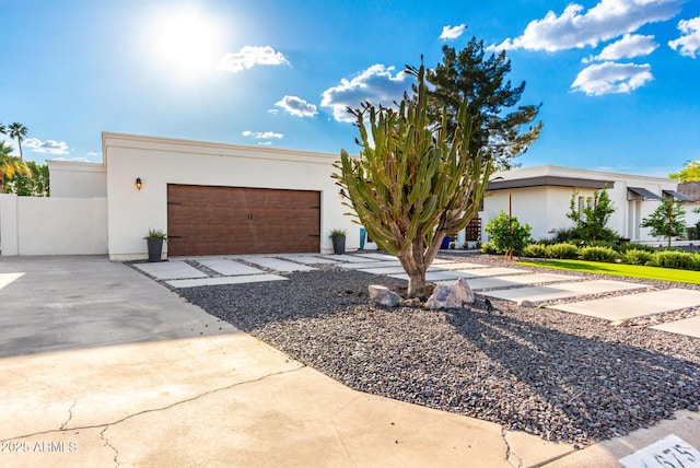 675 Val Verde Cir W, Litchfield Park, AZ 85340 - view of front of house with stucco siding, an attached garage, and driveway