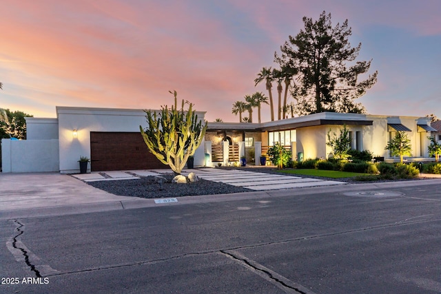 675 Val Verde Cir W, Litchfield Park, AZ 85340 - view of front facade featuring stucco siding and an attached garage