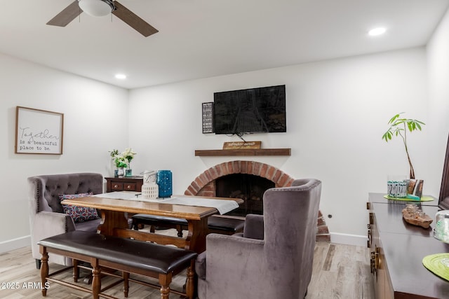 675 Val Verde Cir W, Litchfield Park, AZ 85340 - living area featuring light wood finished floors, baseboards, a ceiling fan, recessed lighting, and a fireplace