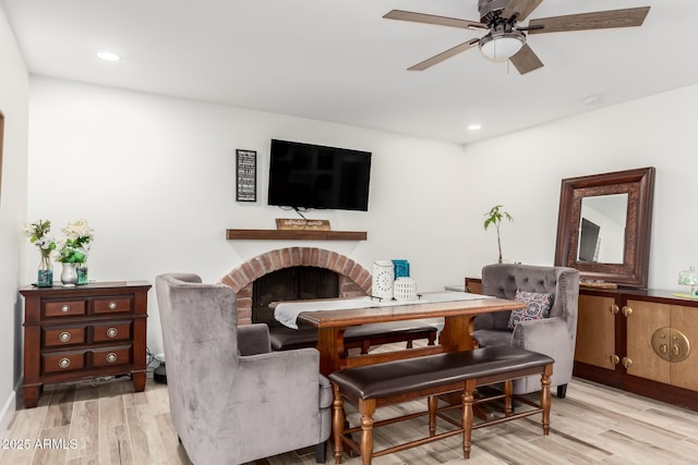 675 Val Verde Cir W, Litchfield Park, AZ 85340 - living room with light wood-style floors, a ceiling fan, a fireplace, recessed lighting, and baseboards